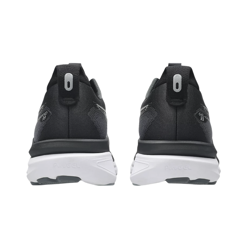 ASICS Men’s Gel-Kayano 33 in Black/White rear heel view displaying the Rearfoot PureGEL™ cushioning, supportive heel counter, padded collar, reflective details, and stable heel platform engineered for shock absorption, motion control, and smooth heel-to-toe transitions.