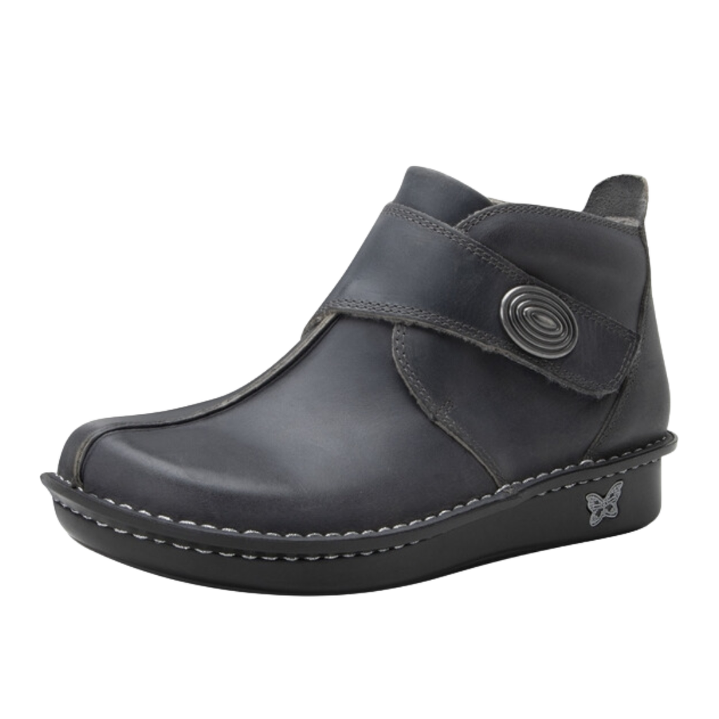 Side view of the Women’s Alegria Caiti in Oiled Ash, highlighting the premium leather upper, stylish ankle boot silhouette, adjustable hook-and-loop strap, and supportive mild rocker outsole.