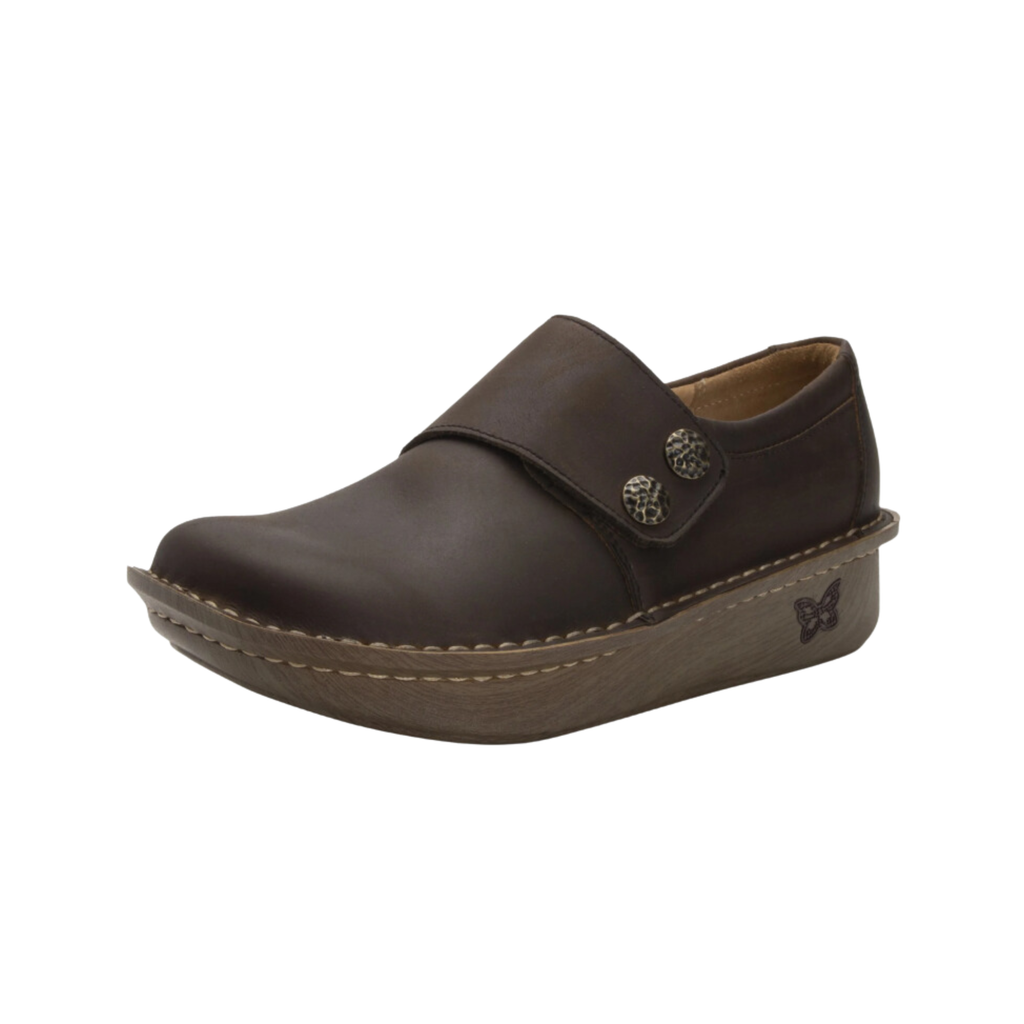 Alegria Women’s Deliah Slip-On Shoe in Oiled Brown side view showcasing the smooth leather upper, double elastic side gores, padded heel collar, mild rocker bottom, and slip-resistant outsole designed for professional style and all-day comfort.