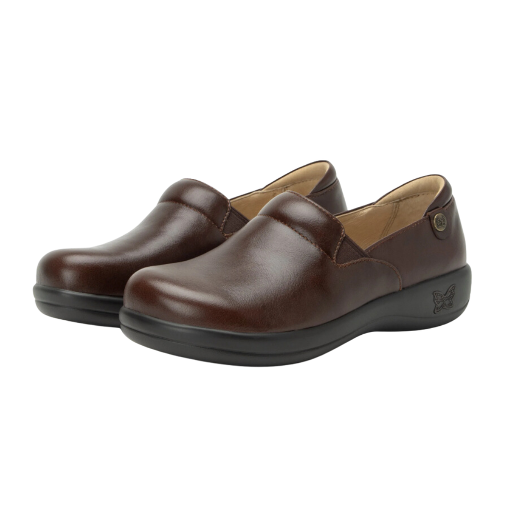 Alegria Women’s Keli Slip-On Shoe in Choco Luster side view showcasing the stain-resistant leather upper with a rich brown luster finish, professional slip-on silhouette, padded collar, mild rocker sole, and slip-resistant outsole designed for lasting comfort and workplace stability.