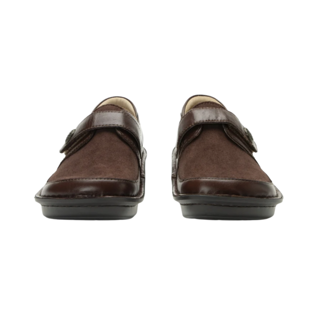 Alegria Women’s Brenna Slip-On in Choco Luster front view highlighting the rounded toe design, rich leather finish, seamless slip-on entry with elastic side panels, and roomy toe box that promotes natural toe splay and reduces forefoot pressure.