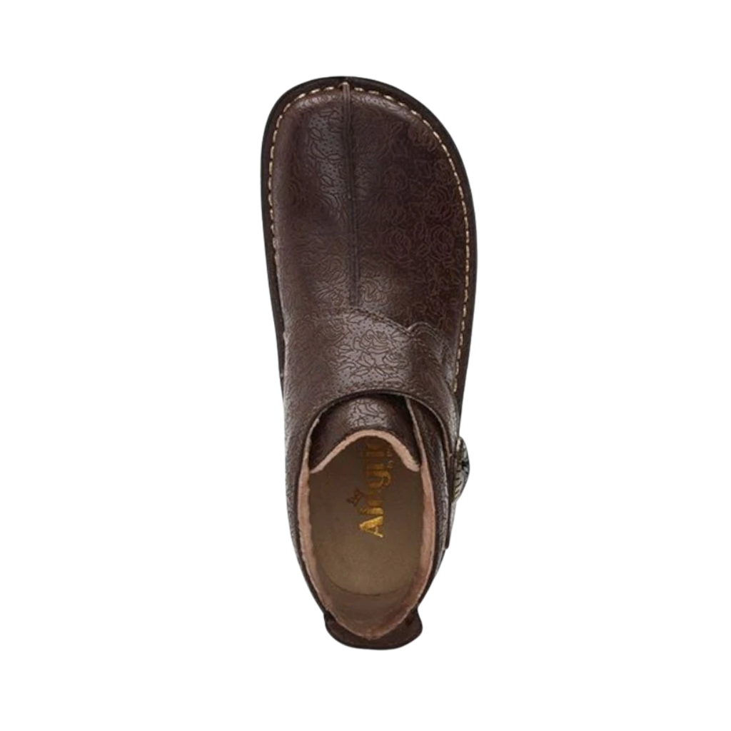 Alegria Women’s Caiti ankle boot in Cocoa Impression top view showcasing the premium leather upper, adjustable strap for a customized fit, removable contoured Alegria footbed, and cushioned interior designed for arch support and long-lasting comfort.