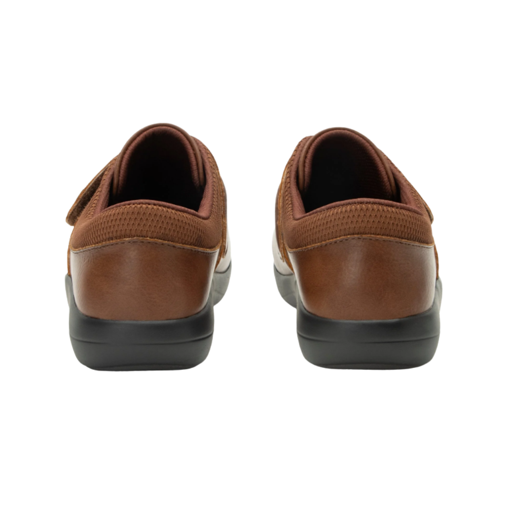Alegria Women’s Danni Slip-On Shoe in Saddle rear heel view displaying the padded ankle collar, supportive heel construction, durable vegan leather materials, and slip-resistant outsole designed for traction and comfort during extended wear.