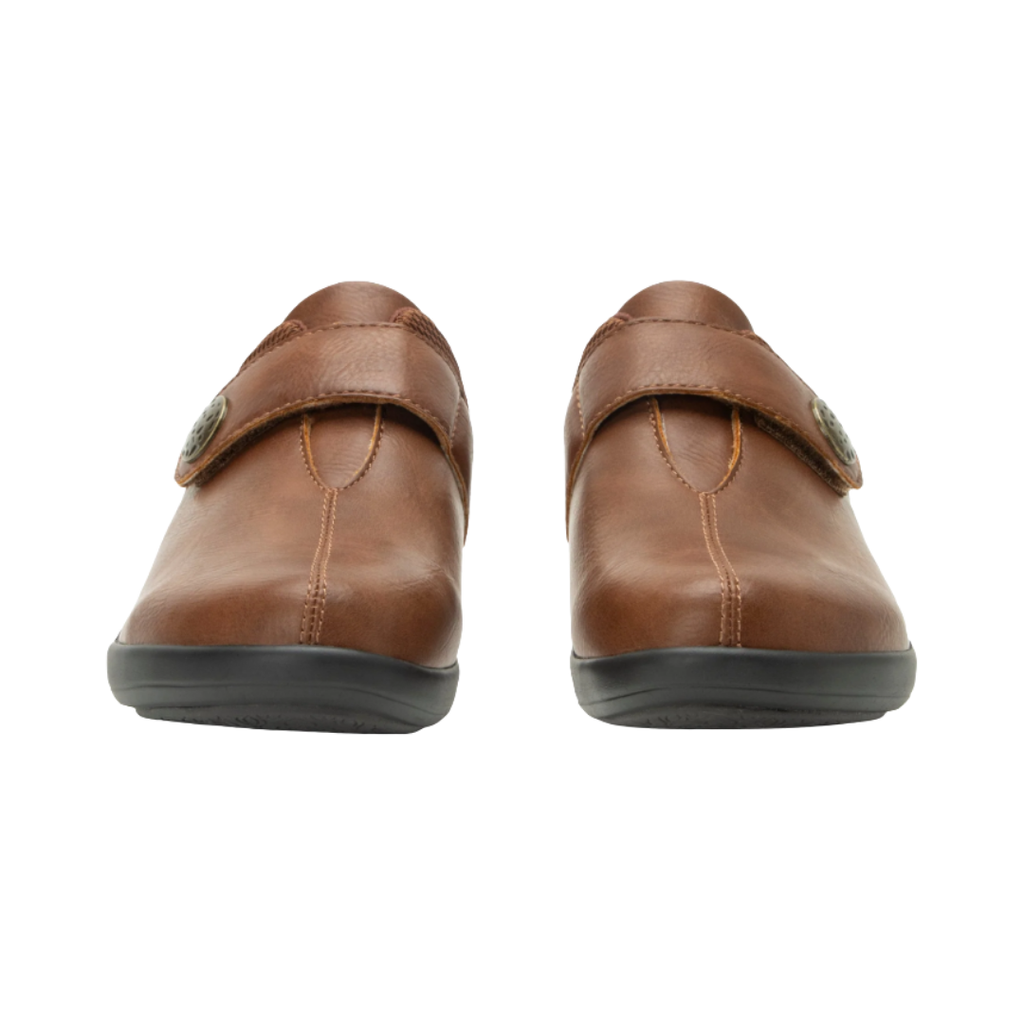 Alegria Women’s Danni Slip-On Shoe in Saddle front view highlighting the rounded toe box, smooth vegan leather upper, easy-access hook-and-loop strap, and comfortable slip-on silhouette designed to provide a secure fit and reduced forefoot pressure.
