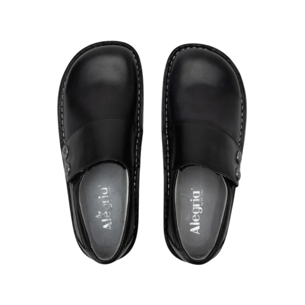 Alegria Women’s Deliah Slip-On Shoe in Upgrade Black top view showcasing the smooth leather upper, dual elastic side gores for a flexible fit, spacious foot opening, and removable Alegria footbed with cork, polyurethane, and memory foam cushioning.