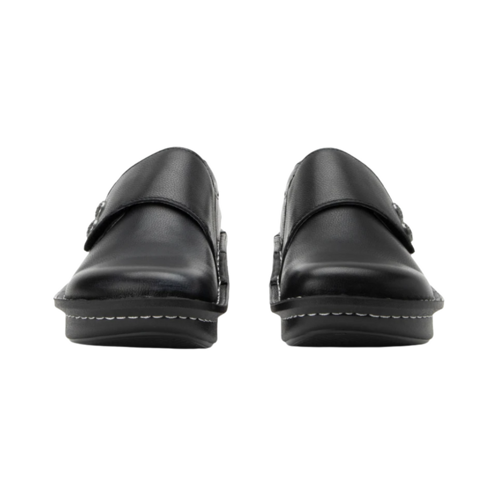 Alegria Women’s Deliah Slip-On Shoe in Upgrade Black front view highlighting the sleek black leather upper, rounded toe design, flexible slip-on entry, and streamlined comfort shoe profile ideal for healthcare workers, educators, and long days on your feet.