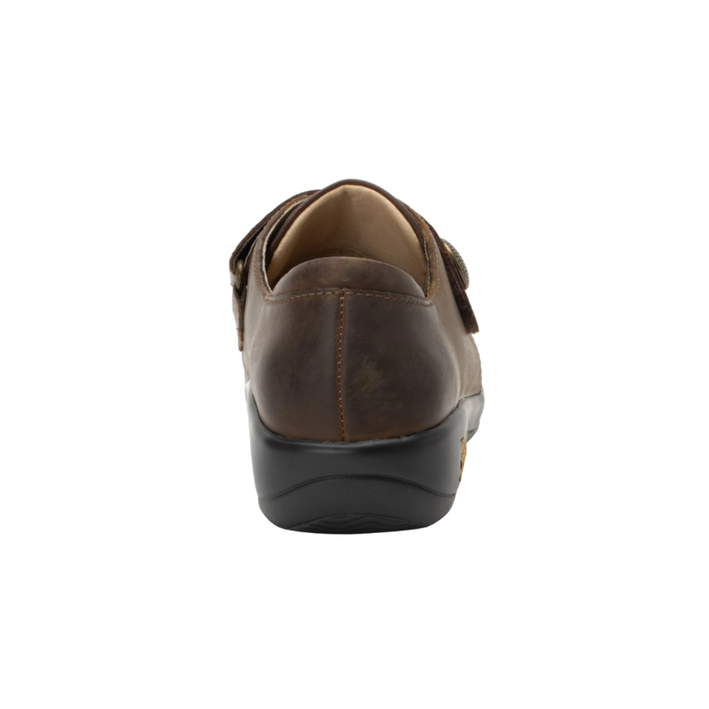 Alegria Women’s Joleen Slip-On Shoe in Oiled Brown rear heel view displaying the padded collar, soft interior lining, supportive heel construction, and slip-resistant rocker outsole designed to enhance stability and reduce fatigue during long days.