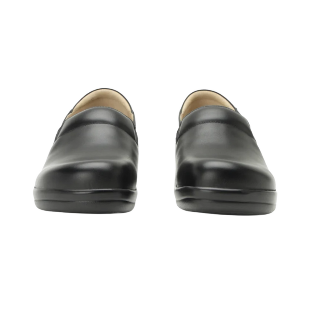 Alegria Women’s Keli Slip-On Shoe in Black Nappa front view highlighting the embossed leather upper, rounded roomy toe box, twin elastic gore panels, and polished slip-on design ideal for healthcare, culinary, and service professionals.