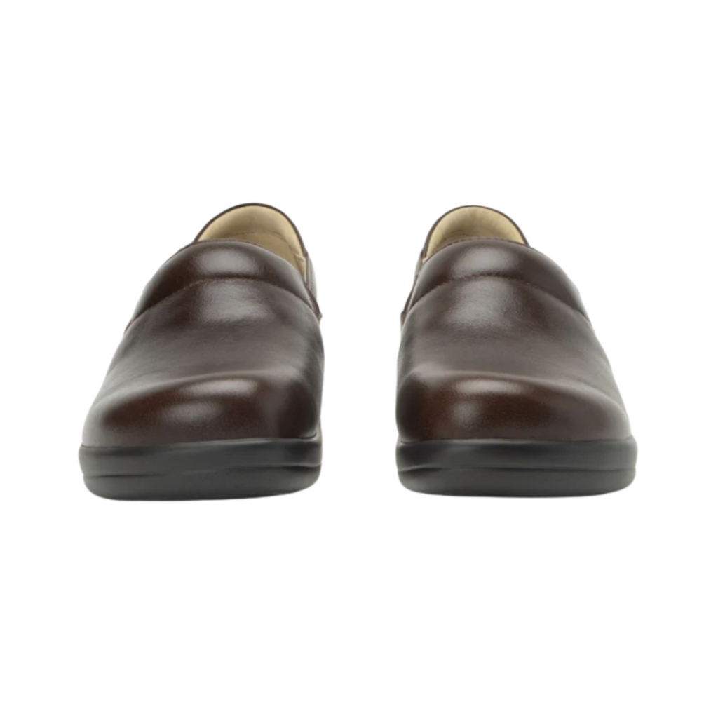 Alegria Women’s Keli Slip-On Shoe in Choco Luster front view highlighting the smooth leather upper, rounded roomy toe box, twin elastic gore panels, and classic slip-on design ideal for healthcare, culinary, hospitality, and service professionals.
