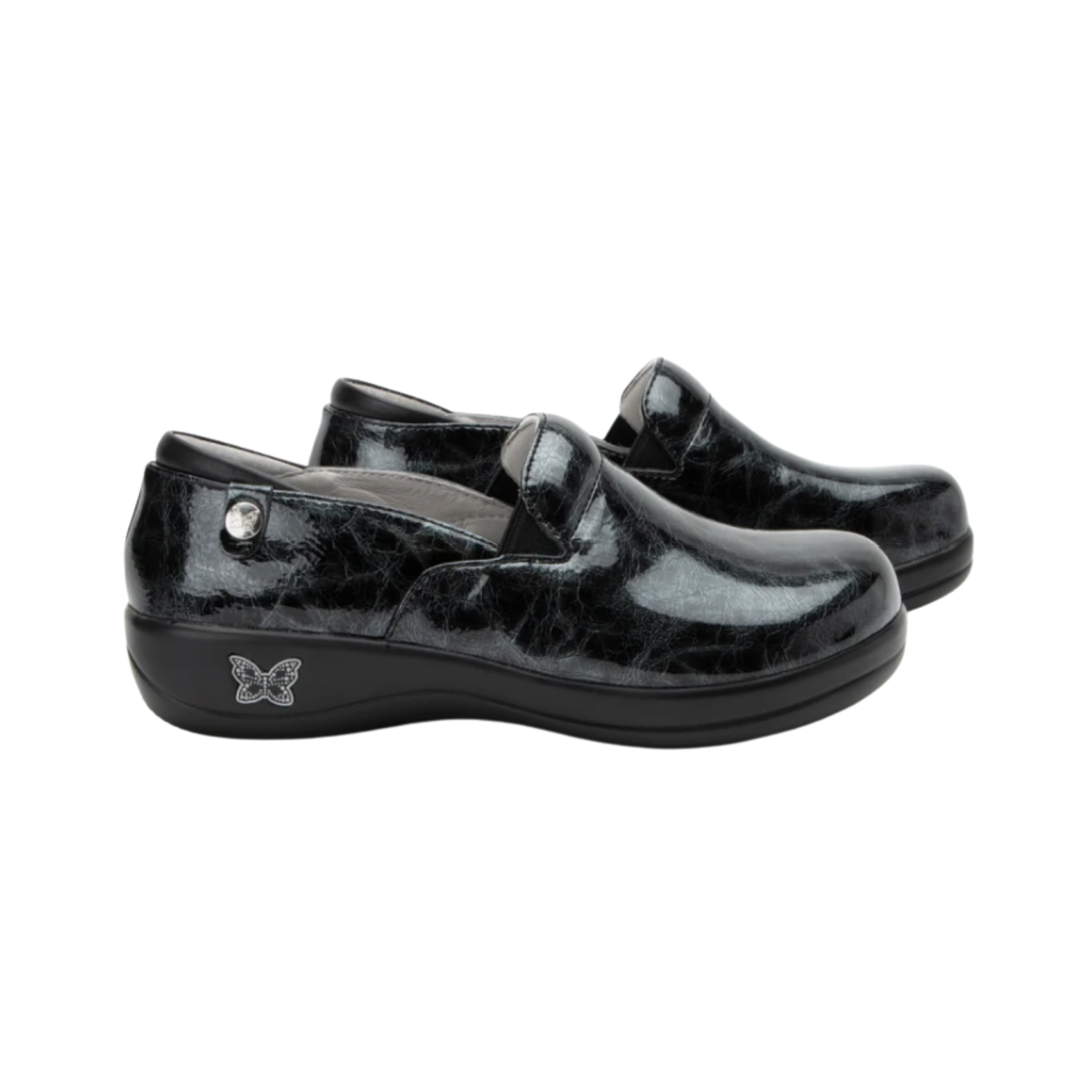 Alegria Women’s Keli Slip-On Shoe in Mantle side view showcasing the stain-resistant leather upper with a rich brown luster finish, professional slip-on silhouette, padded collar, mild rocker sole, and slip-resistant outsole designed for lasting comfort and workplace stability.