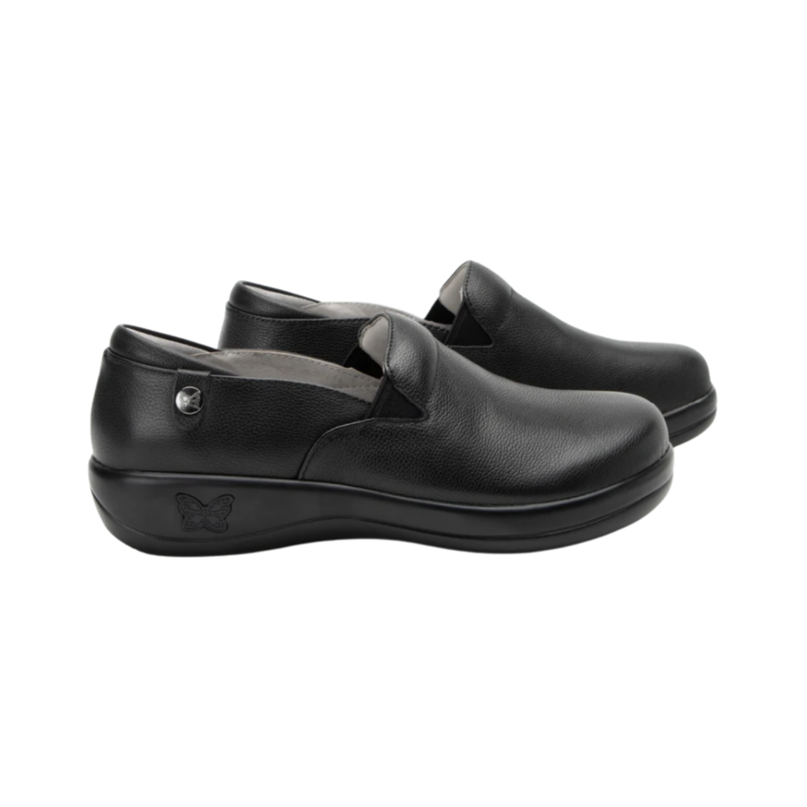 Alegria Women’s Keli Slip-On Shoe in Upgrade Black side view showcasing the stain-resistant embossed leather upper, professional slip-on silhouette, padded collar, mild rocker sole, and slip-resistant outsole designed for lasting comfort and workplace stability.