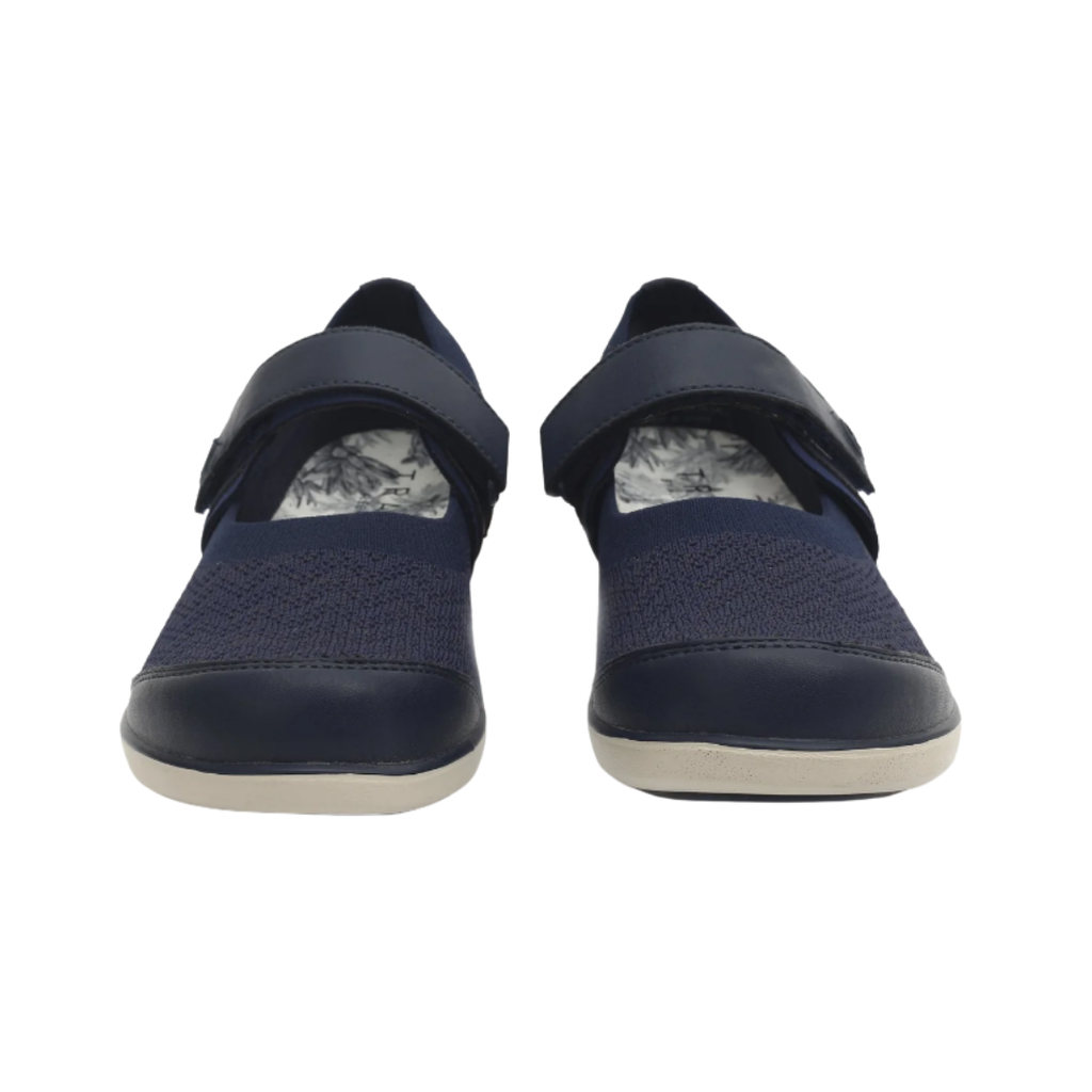 Alegria Women’s TRAQ Qutie Slip-On Shoe in Blue Multi front view highlighting the breathable blue multicolor knit toe box, flexible slip-on design, adjustable strap closure, and rounded athletic profile designed for a comfortable, customized fit.