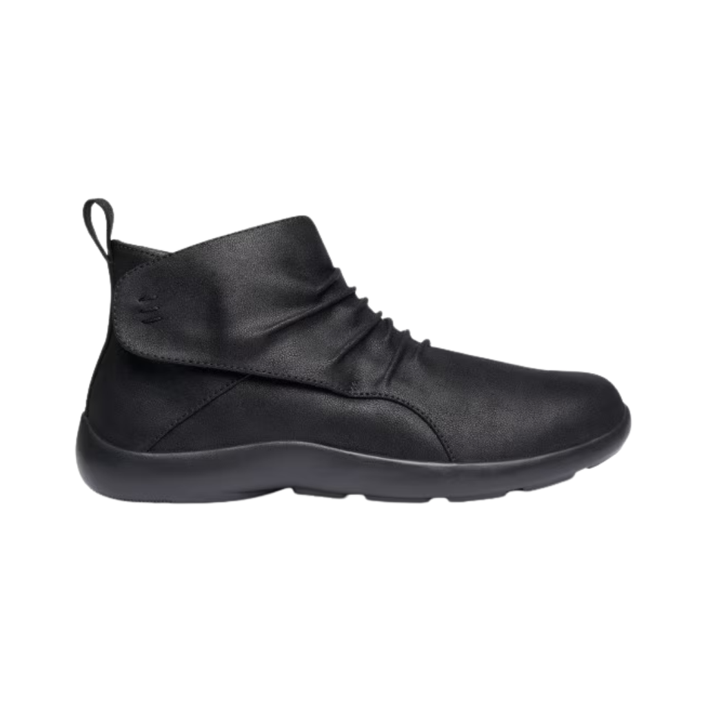 Anodyne Women’s #91 Casual Boot Therapeutic Shoe in Black side view showcasing the vegan leather upper, ankle-height boot design, adjustable hook-and-loop strap closure, padded collar, extra-depth construction, supportive heel counter, and lightweight outsole designed for all-day orthopedic comfort.