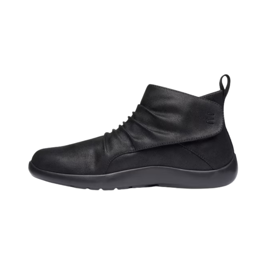 Anodyne Women’s #91 Casual Boot Therapeutic Shoe in Black side view showcasing the vegan leather upper, ankle-height boot design, adjustable hook-and-loop strap closure, padded collar, extra-depth construction, supportive heel counter, and lightweight outsole designed for all-day orthopedic comfort.
