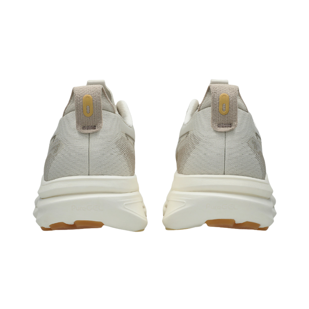 Heel view of the Women's ASICS Gel-Kayano 33 in Oatmeal/Cream, highlighting the supportive heel structure, rearfoot PureGEL™ technology for shock absorption, and reflective details for improved low-light visibility.