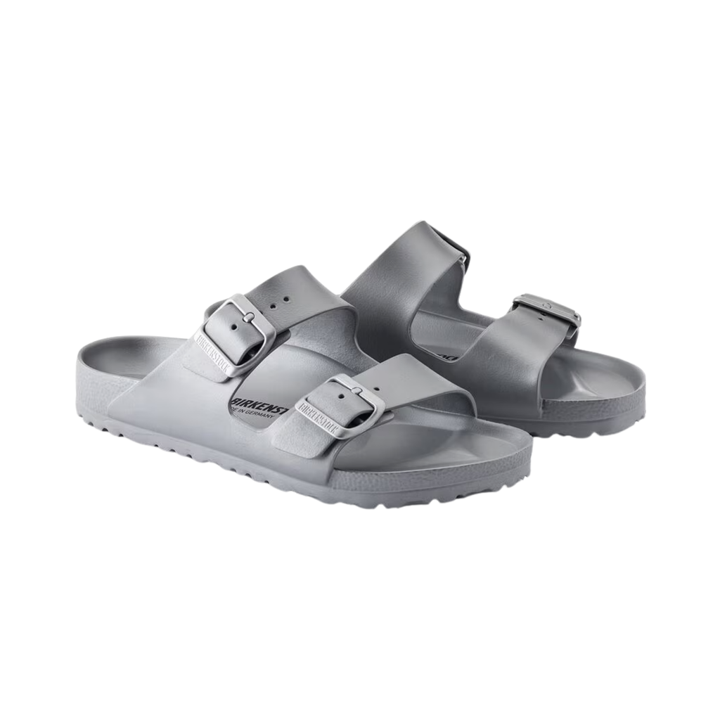 Birkenstock Arizona Essentials EVA in Metallic Silver featuring a lightweight one-piece molded EVA construction, iconic dual-strap silhouette, adjustable buckles, contoured footbed, and shock-absorbing EVA outsole designed for waterproof comfort and everyday versatility.