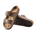 Top and bottom view of the Birkenstock Unisex Arizona in Tobacco Brown Oiled Leather displaying the premium oiled leather upper, suede footbed lining, adjustable dual buckle straps, anatomically shaped cork-latex footbed with arch and heel support, and lightweight EVA outsole designed for flexibility, traction, and support for conditions such as plantar fasciitis, flat feet, heel spurs, metatarsalgia, arthritis, joint pain, and overpronation.