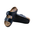 Top/bottom view of the Birkenstock Unisex Arizona Soft Footbed in Blue Oiled Leather, displaying both the cushioned cork-latex soft footbed with suede lining and the flexible EVA outsole for supportive, shock-absorbing comfort.