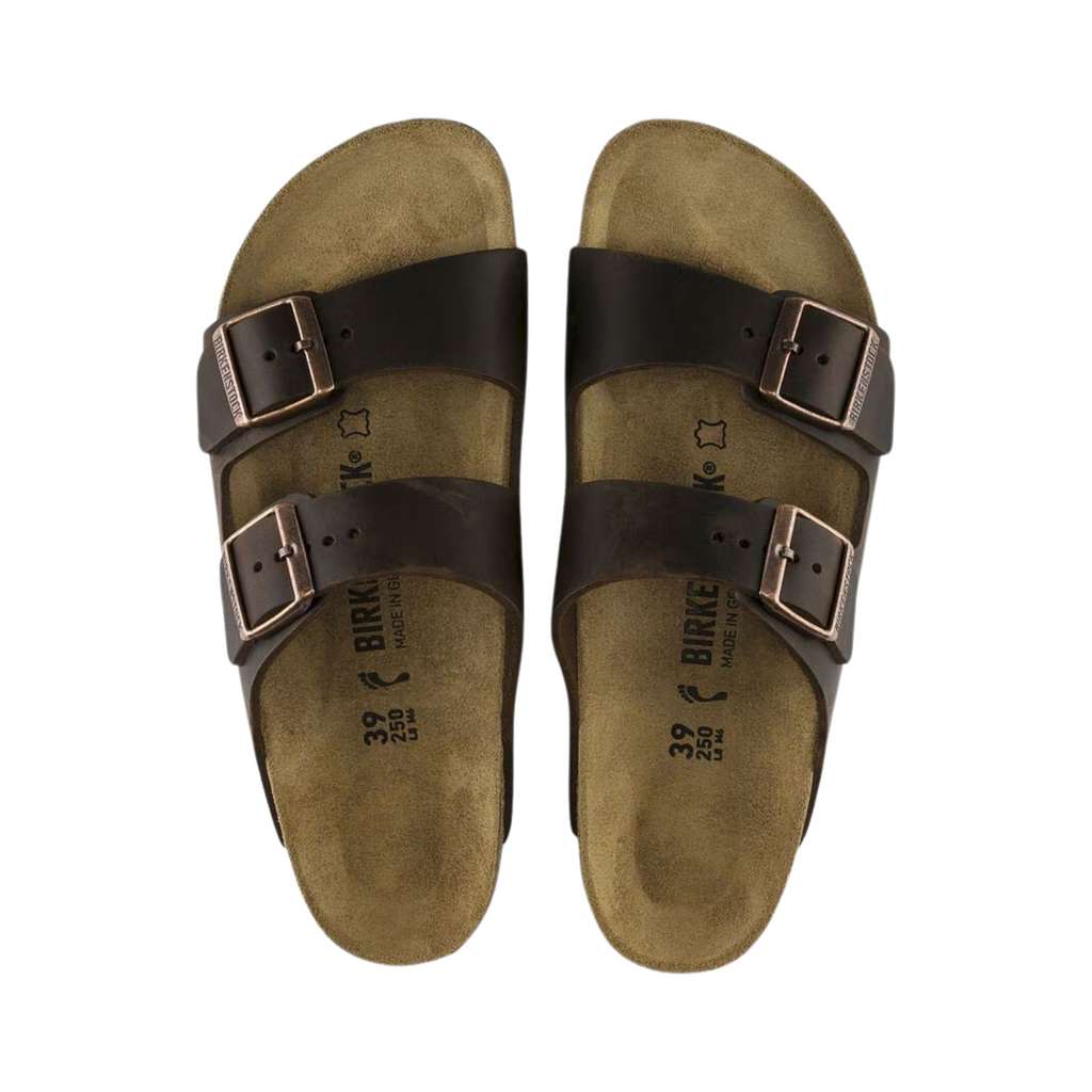 Top view of the Birkenstock Unisex Arizona in Habana Oiled Leather, showing the suede-lined footbed, adjustable buckled straps, and contoured support designed to mold to the natural shape of the foot.