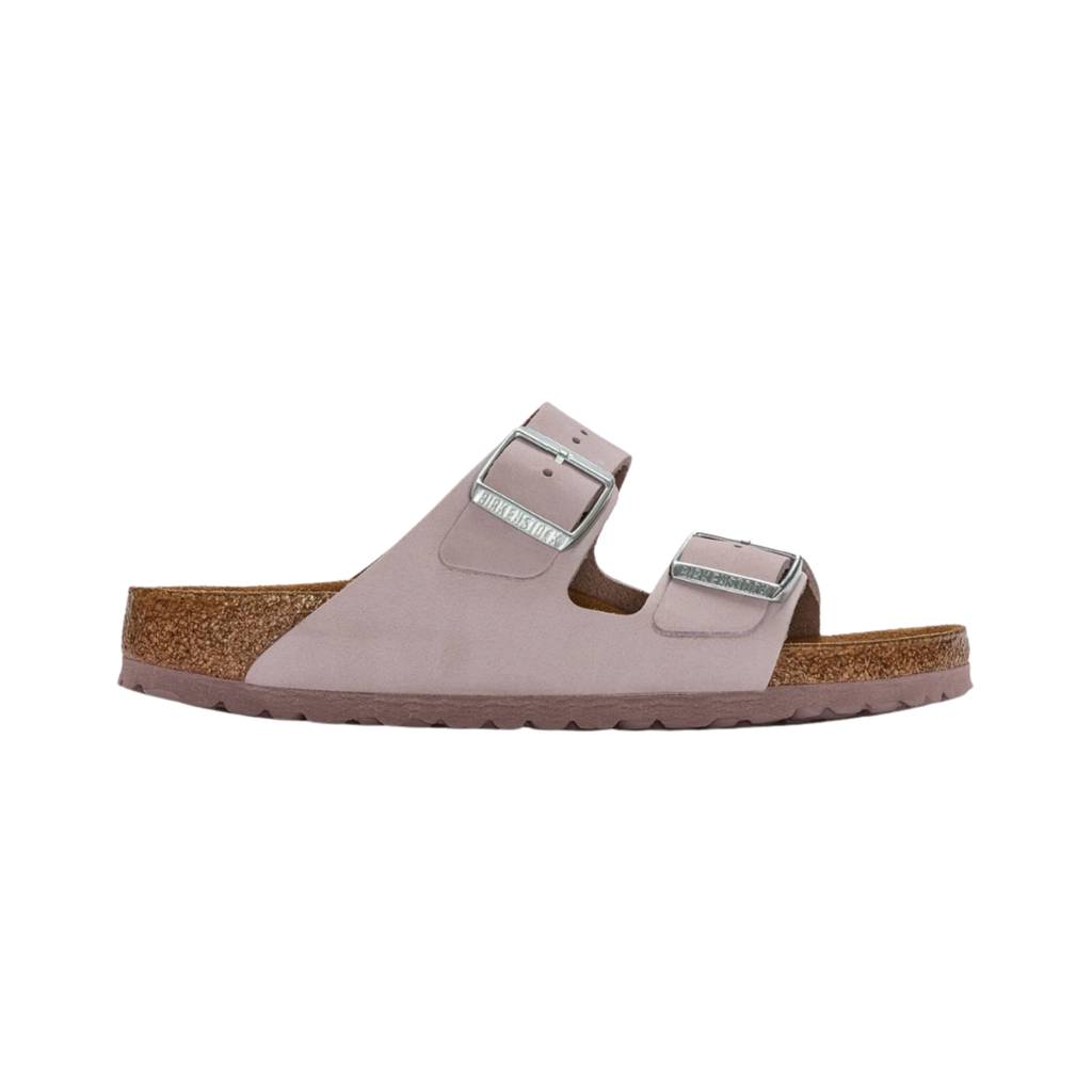 Birkenstock Women’s Arizona Soft Footbed in Yomo Lilac Nubuck Leather featuring a premium nubuck leather upper in a soft lavender tone, iconic dual-strap design with adjustable metal buckles, cushioned Soft Footbed with added foam layer, suede footbed lining, and lightweight EVA outsole designed for feminine style, everyday comfort, and reliable support.