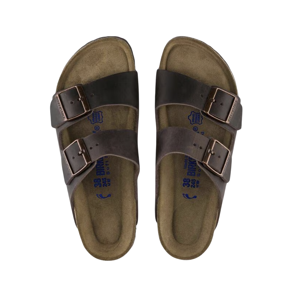 Top view of the Birkenstock Unisex Arizona in Habana Oiled Leather displaying the premium oiled leather upper, suede footbed lining, adjustable dual buckle straps, anatomically shaped cork-latex footbed with arch and heel support, and lightweight EVA outsole designed for flexibility, traction, and support for conditions such as plantar fasciitis, flat feet, heel spurs, metatarsalgia, arthritis, joint pain, and overpronation.