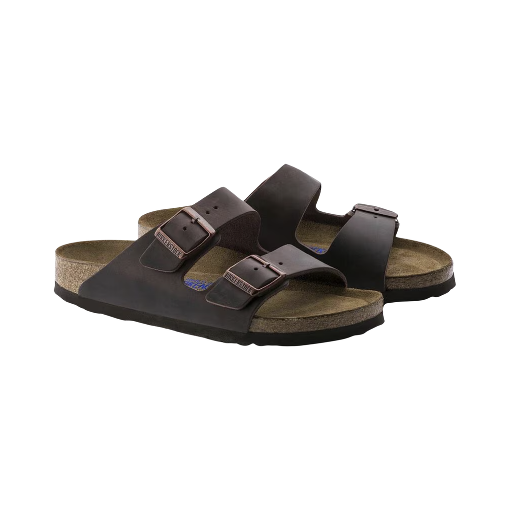 Birkenstock Unisex Arizona in Habana Oiled Leather featuring a premium oiled leather upper with a rich patina finish, iconic dual-strap design with adjustable metal buckles, suede-lined anatomical cork-latex footbed, and lightweight EVA outsole designed for timeless style, comfort, and everyday support.