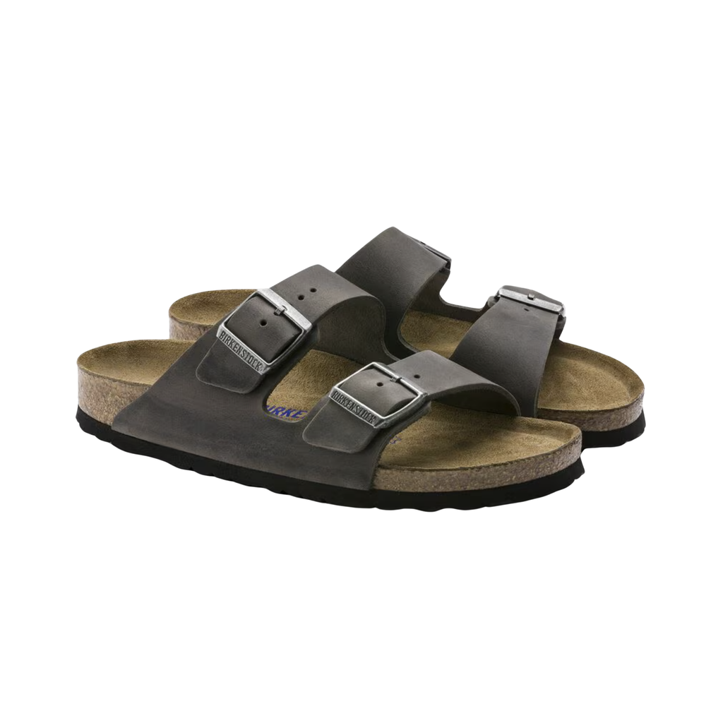 Side view of the Birkenstock Unisex Arizona Soft Footbed in Iron Oiled Leather, showing the classic two-strap design, durable oiled leather upper, and contoured cork-latex footbed for supportive everyday comfort.