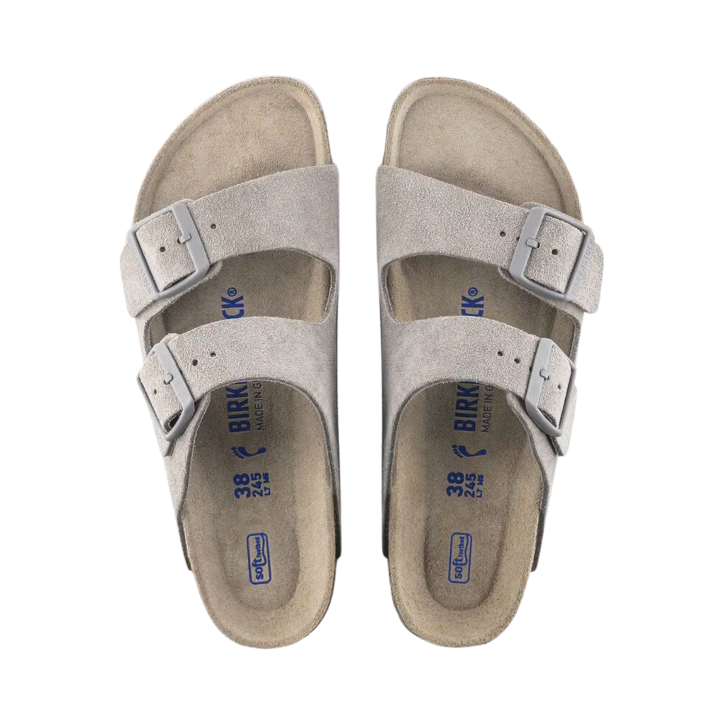 Top view of the Birkenstock Women’s Arizona Soft Footbed Suede Leather in Stone Coin, showing the dual straps, breathable suede lining, and cushioned soft footbed with extra latex padding for long-lasting comfort.