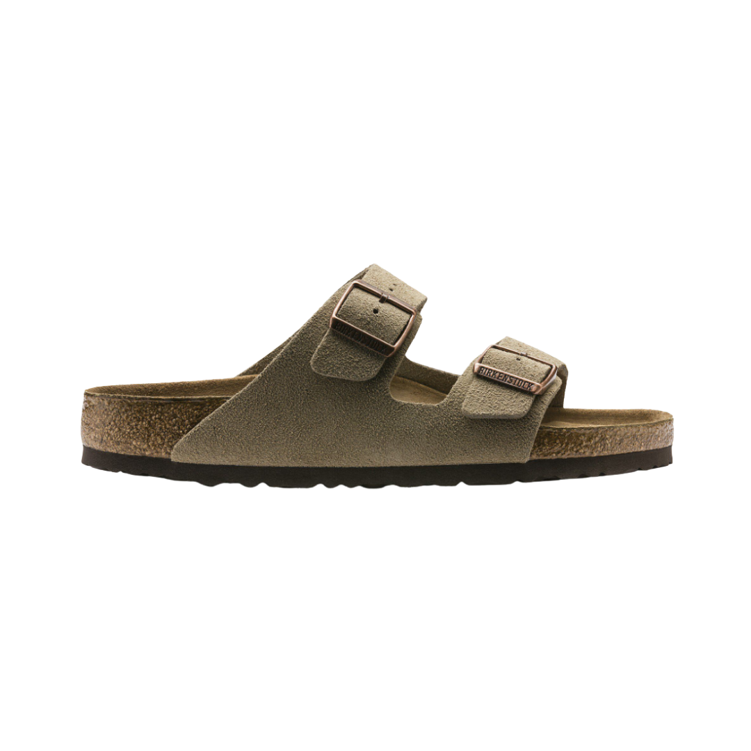 Side view of the Birkenstock Women’s Arizona Soft Footbed Suede Leather in Taupe, showing the dual adjustable straps with metal buckles, soft suede upper, and anatomically shaped cork-latex footbed for customized arch support and comfort.