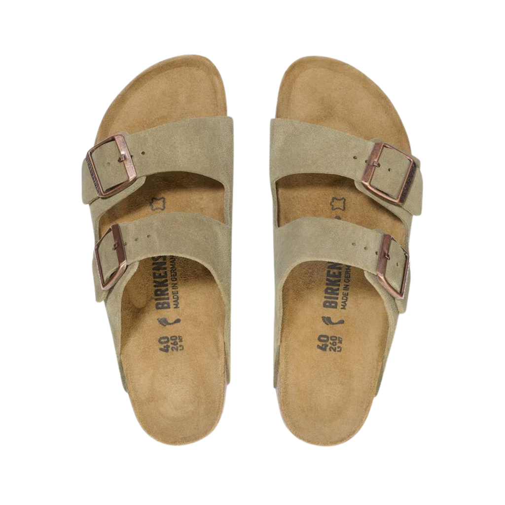 Top view of the Birkenstock Arizona in Taupe Suede Leather displaying the premium suede leather upper, adjustable dual buckle straps, anatomically shaped cork-latex footbed with arch support, deep heel cup, raised toe bar, and lightweight EVA outsole designed for flexibility, traction, and support for conditions such as plantar fasciitis, flat feet, heel spurs, overpronation, metatarsalgia, and general foot fatigue.