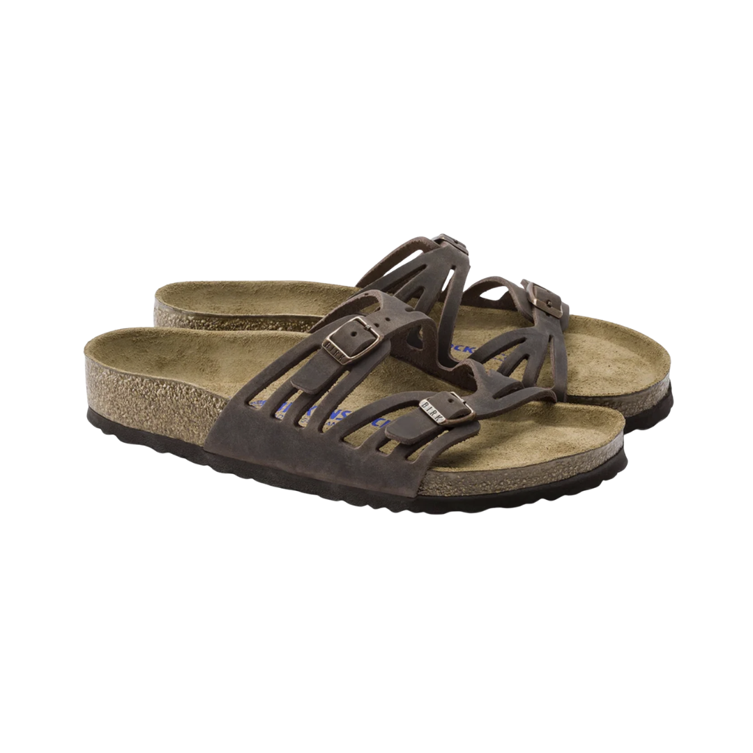 Birkenstock Women’s Granada Soft Footbed in Habana Oiled Leather featuring a premium oiled leather upper in a rich earthy brown finish, multi-strap design with adjustable buckles, cushioned Soft Footbed with added foam layer, anatomically shaped cork-latex footbed, and lightweight EVA outsole designed for elegant style, personalized comfort, and everyday support.