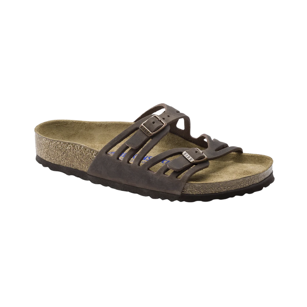 Birkenstock Women’s Granada Soft Footbed in Habana Oiled Leather featuring a premium oiled leather upper in a rich earthy brown finish, multi-strap design with adjustable buckles, cushioned Soft Footbed with added foam layer, anatomically shaped cork-latex footbed, and lightweight EVA outsole designed for elegant style, personalized comfort, and everyday support.
