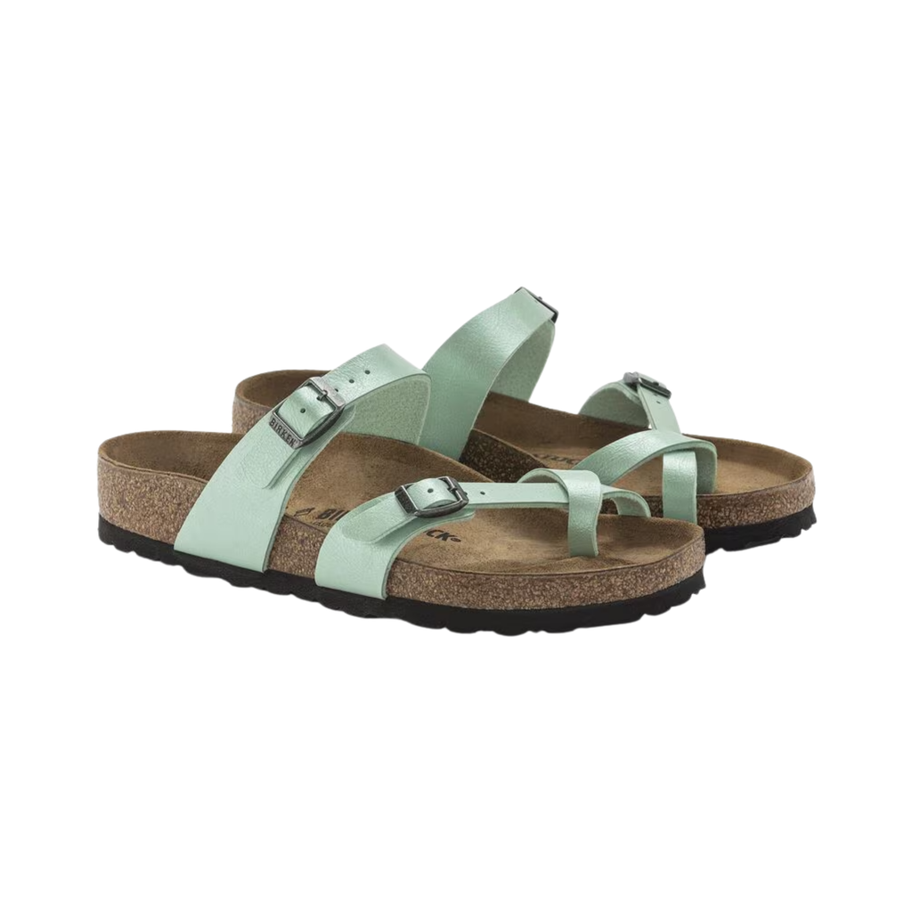 Birkenstock Mayari in Graceful Matcha Birko-Flor featuring a durable Birko-Flor upper with a metallic green finish, elegant toe-loop design with crisscrossing adjustable straps, anatomically shaped cork-latex footbed, and lightweight EVA outsole designed for stylish comfort, personalized support, and everyday wear.
