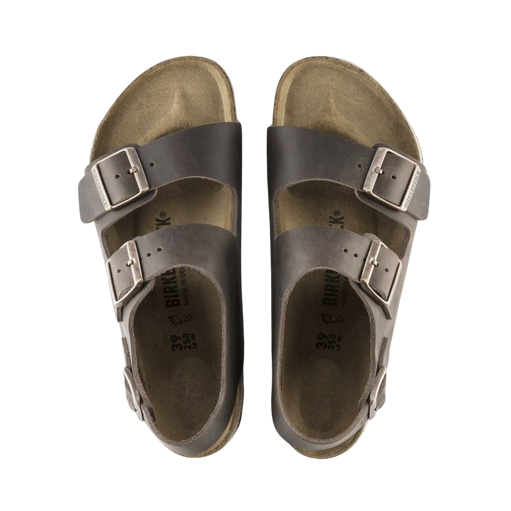 Top view of the Birkenstock Women’s Milano in Habana Oiled Leather displaying the premium oiled leather upper, adjustable three-strap system, raised toe bar, contoured cork-latex footbed with arch and heel support, and lightweight EVA outsole designed for flexibility, traction, and support for conditions such as plantar fasciitis, flat feet, overpronation, heel pain, heel spurs, metatarsalgia, bunions, and general foot fatigue.