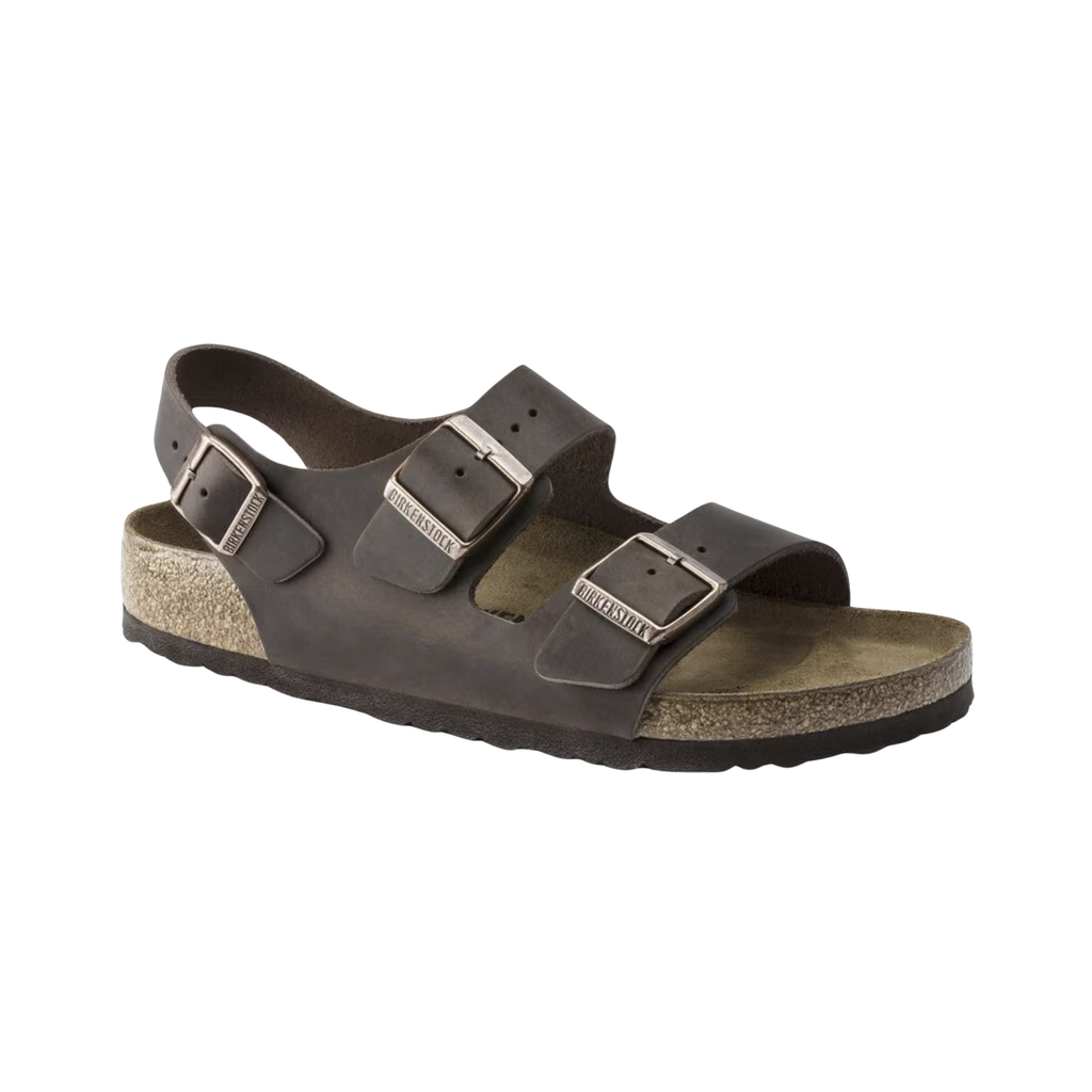 Birkenstock Women’s Milano in Habana Oiled Leather featuring a premium oiled leather upper with a natural patina finish, three-strap adjustable design with metal buckles, supportive heel backstrap, contoured cork-latex footbed, and lightweight EVA outsole designed for secure comfort and everyday stability.