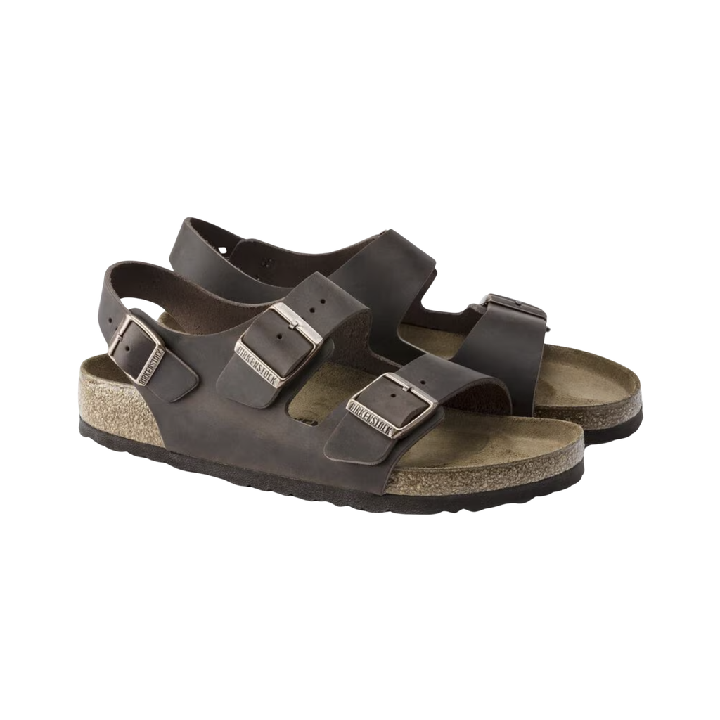 Birkenstock Women’s Milano in Habana Oiled Leather featuring a premium oiled leather upper with a natural patina finish, three-strap adjustable design with metal buckles, supportive heel backstrap, contoured cork-latex footbed, and lightweight EVA outsole designed for secure comfort and everyday stability.
