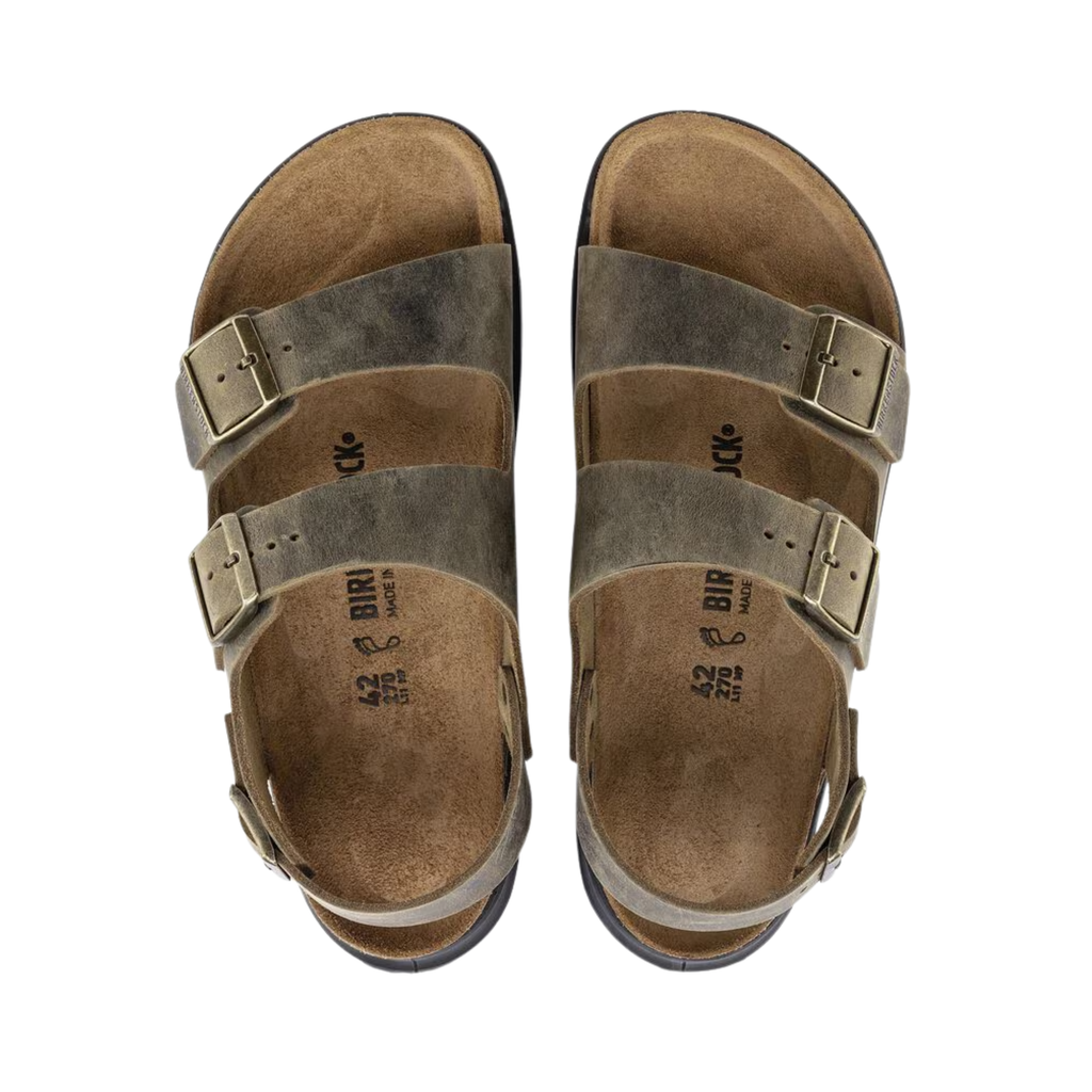 Top view of the Birkenstock Men’s Milano Rugged in Faded Khaki Oiled Leather displaying the breathable oiled leather upper, three-point adjustable strap system, raised toe bar, anatomically shaped cork-latex footbed with arch and heel support, and textured rugged EVA outsole designed for traction, flexibility, and support for conditions such as plantar fasciitis, flat feet, heel spurs, overpronation, metatarsalgia, bunions, and general foot fatigue.