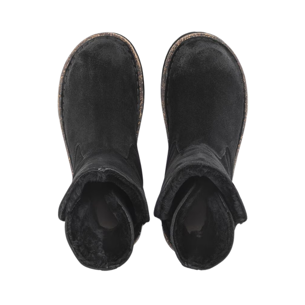 Top view of the Birkenstock Women’s Uppsala Shearling Boot in Black Suede displaying the soft suede leather upper, shearling-lined opening, cozy insulated interior, elastic side panels for easy slip-on wear, anatomically shaped cork-latex footbed with arch support and heel stabilization, and flexible rubber outsole with traction pattern designed for warmth, stability, shock absorption, and support for conditions such as plantar fasciitis, arthritis, flat feet, heel spurs, cold-sensitive feet, and