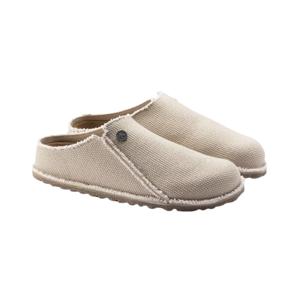Birkenstock Women’s Zermatt Canvas Slipper in Eggshell Textile featuring a breathable textile upper, easy slip-on design, anatomical cork-latex footbed, moisture-wicking lining, and durable rubber outsole designed for lightweight comfort, everyday relaxation, and supportive indoor or light outdoor wear.