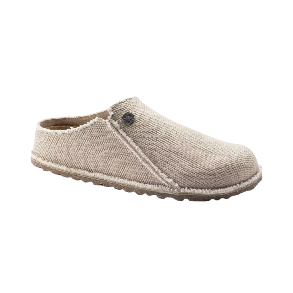 Birkenstock Women’s Zermatt Canvas Slipper in Eggshell Textile featuring a breathable textile upper, easy slip-on design, anatomical cork-latex footbed, moisture-wicking lining, and durable rubber outsole designed for lightweight comfort, everyday relaxation, and supportive indoor or light outdoor wear.