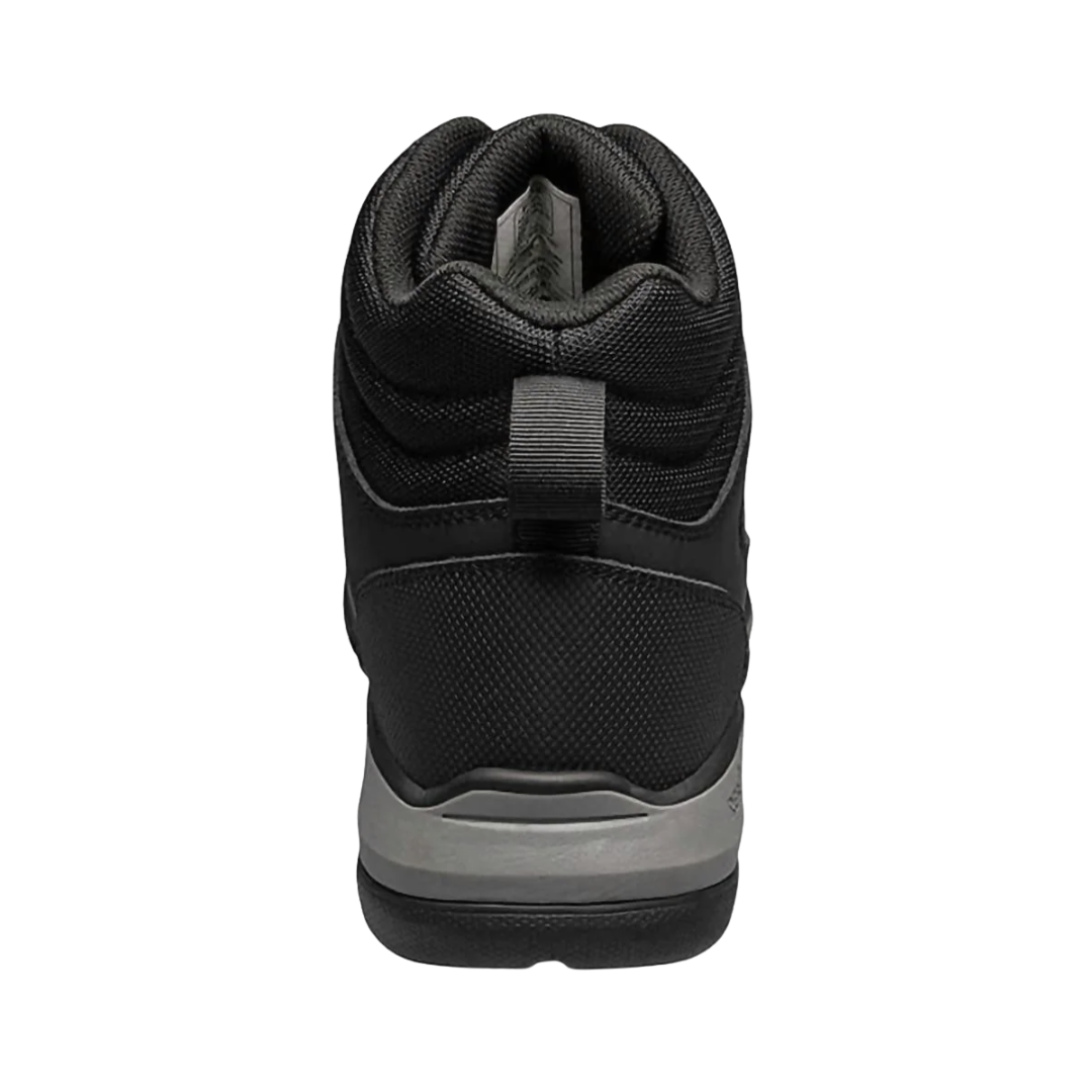 Back heel view of the BOGS Men’s Shale Mid Composite Toe ESD Boot in Black highlighting the supportive mid-height ankle design, durable waterproof upper, cushioned heel construction, and stable BioGrip outsole platform for enhanced comfort, traction, and workplace performance.