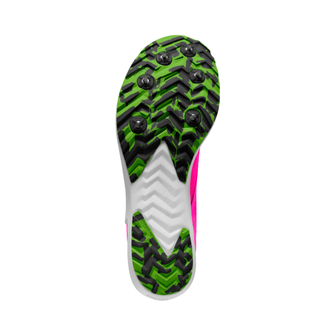 Bottom outsole view of the Brooks Women’s Draft XC Spike in Pink Glo/Green/Black featuring the aggressive spike plate with 6 removable spikes and durable rubber lug outsole designed to maximize traction, grip, and stability on dirt, grass, gravel, and varied cross-country terrain while supporting conditions such as shin splints, impact stress, neutral arches, forefoot pressure relief, and race-day foot fatigue.
