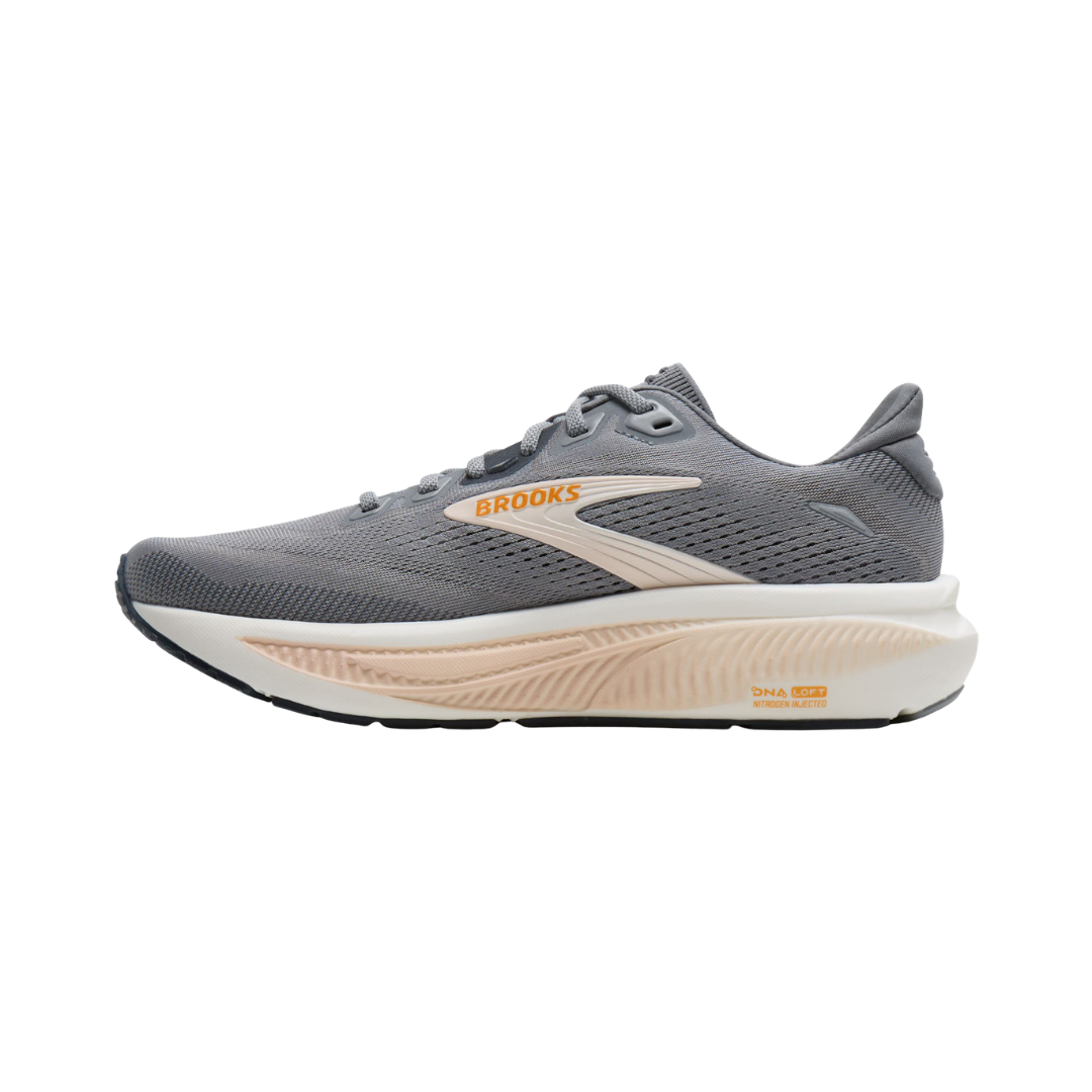 Women's Brooks Ghost 18 running shoe in Grey/Morganite/Coconut featuring balanced cushioning, a secure heel, dynamic forefoot, lightweight construction, and an upper made with 55.3% recycled materials for everyday running and walking.