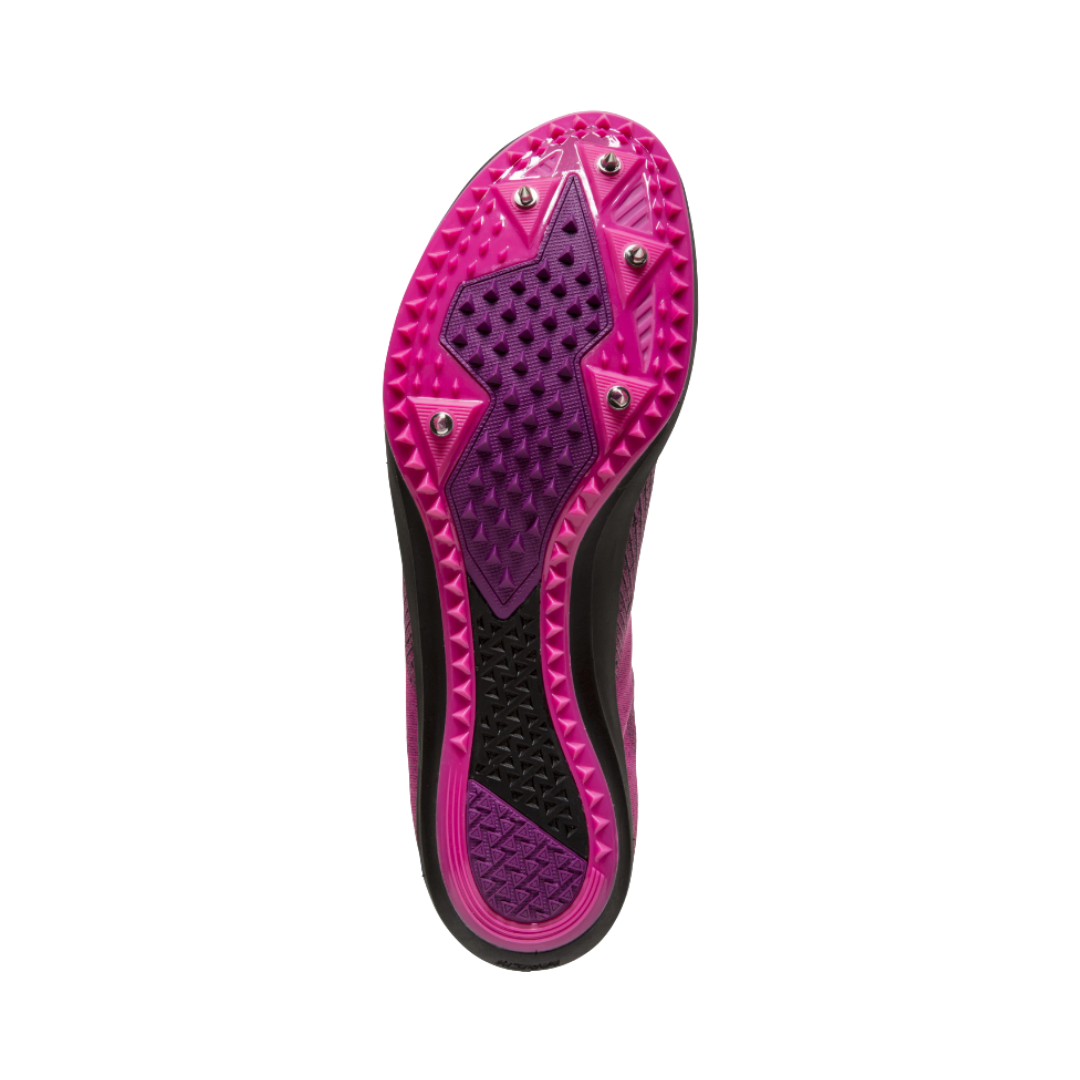 Bottom outsole view of the Brooks Women’s Mach 19 XC Spike in Black/Hollyhock/Pink featuring the full-length Pebax® spike plate with five spike configuration and durable rubber outsole designed to maximize traction, grip, energy return, and propulsion on grass, gravel, and dirt courses while supporting conditions such as shin splints, ankle strain, arch discomfort, and race-day foot fatigue.