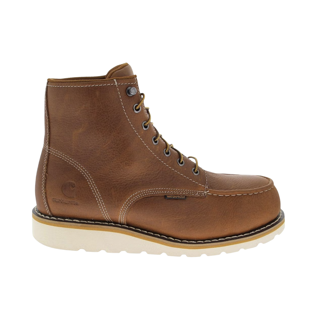 Carhartt Men's Waterproof 6" Wedge (Plain Toe) Boot in Soft Tan featuring an oil-tanned full-grain leather upper, Storm Defender® waterproof membrane, 6-inch work boot silhouette, PU Strobel pad, Cushion Comfort PU insole, steel shank for arch support, and dual-density slip-resistant wedge outsole designed for lasting comfort, stability, and dependable performance.