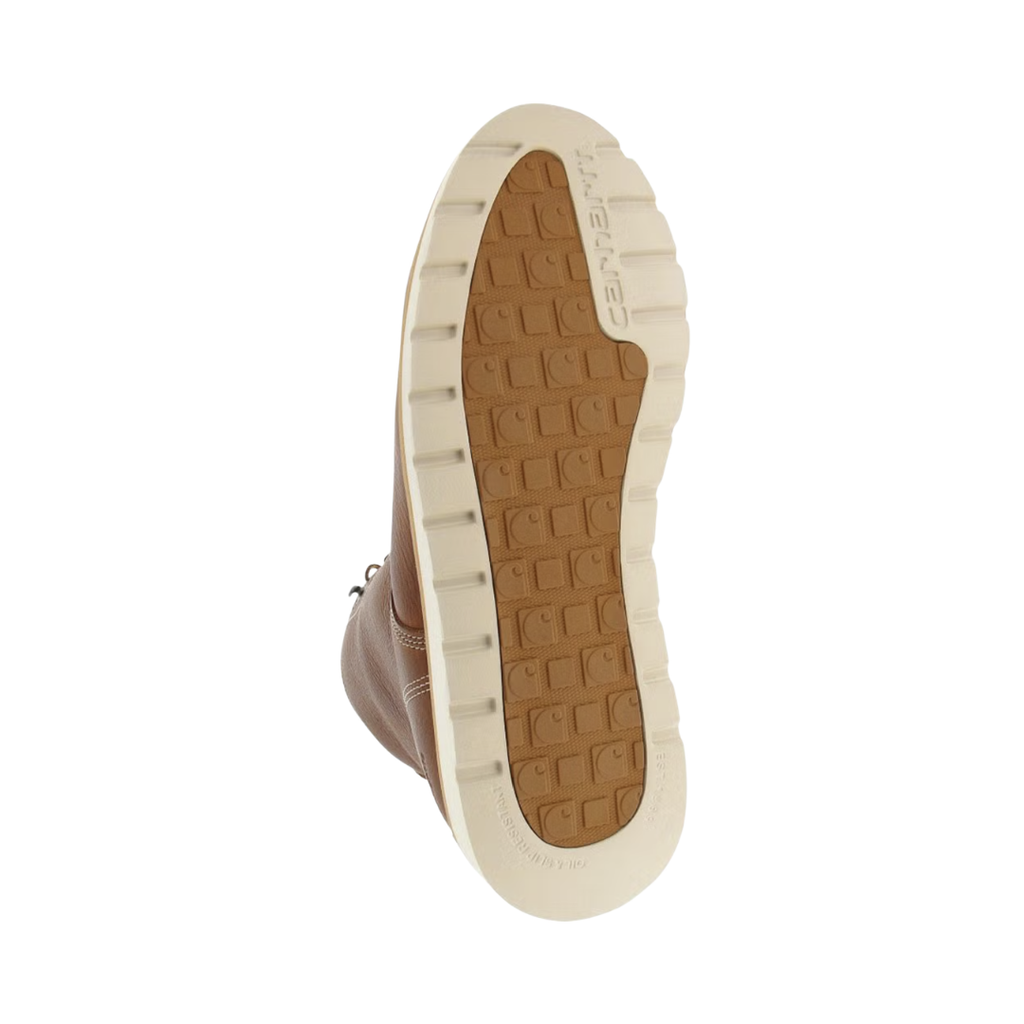 Bottom outsole view of the Carhartt Men's Waterproof 6" Wedge (Plain Toe) Boot in Soft Tan featuring the ASTM F3445-21 SR dual-density slip-resistant rubber wedge outsole engineered for maximum surface contact, dependable traction, and stability on slick surfaces, while ASTM F2892-18 EH electrical hazard protection and supportive cushioning help provide comfort for conditions such as plantar fasciitis, heel pain, flat feet, overpronation, joint pain, and general foot fatigue.