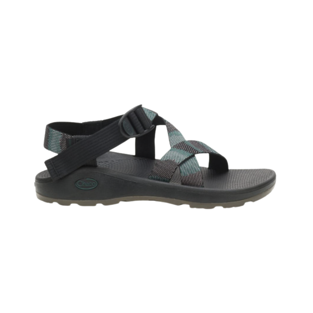 Chaco Men’s ZCloud Sandal in Weave Black featuring quick-dry polyester webbing, the fully adjustable LUVSEAT™ strap system, plush ZCloud™ midsole cushioning, anatomically supportive LUVSEAT™ footbed, and durable ChacoGrip™ rubber outsole designed for all-day comfort, stability, and rugged outdoor performance.