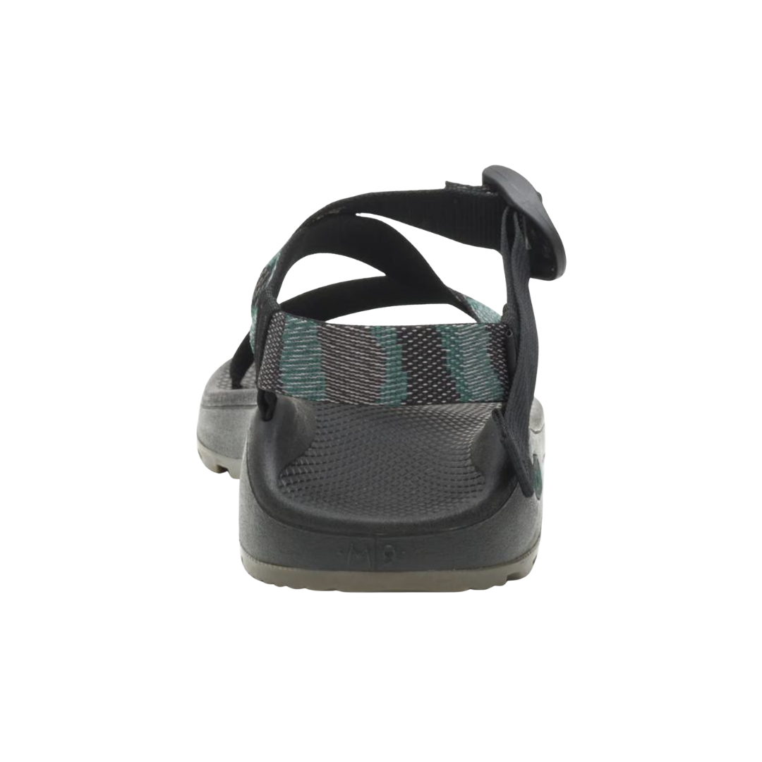 Back heel view of the Chaco Men’s ZCloud Sandal in Weave Black highlighting the adjustable heel strap, supportive LUVSEAT™ footbed, cushioned ZCloud™ midsole, and durable ChacoGrip™ outsole designed to enhance rearfoot stability, comfort, and confidence on uneven terrain.
