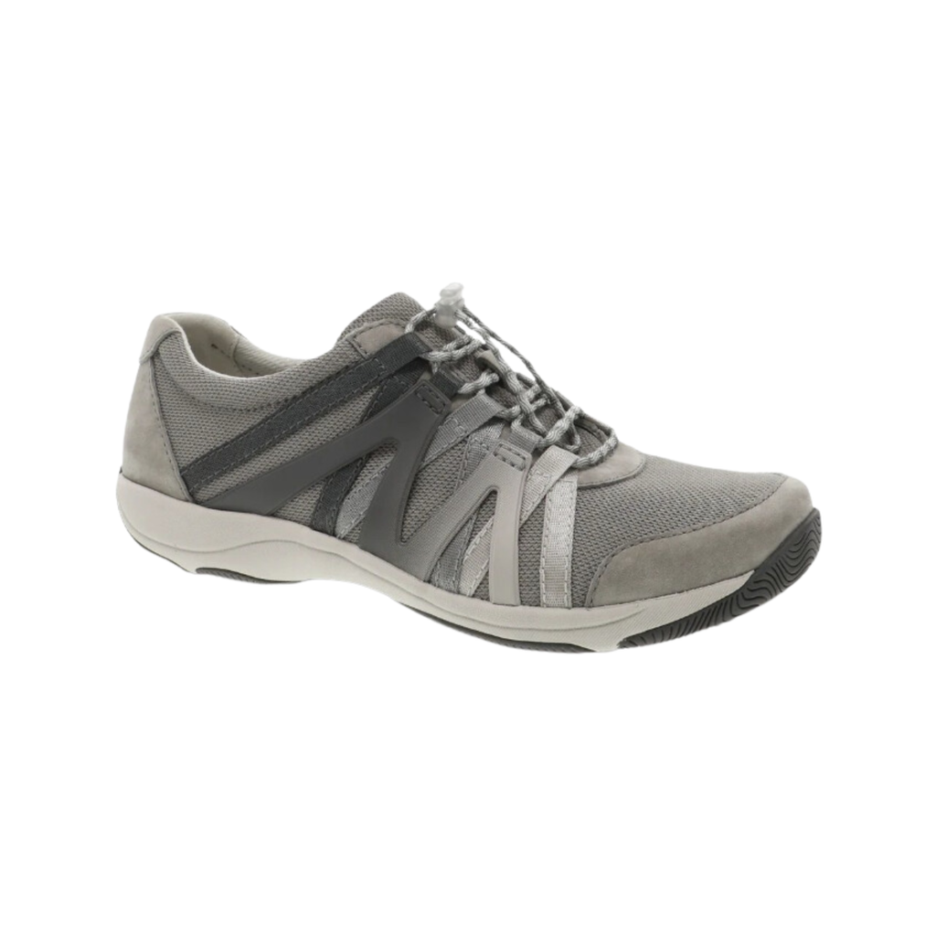 Dansko Women’s Henriette Suede Shoe in Grey featuring a premium suede and recycled mesh upper, sporty low-top silhouette, adjustable bungee laces, removable EVA footbed, Strobel construction, natural rubber outsole, and lightweight design built for breathable comfort, flexibility, and all-day support.