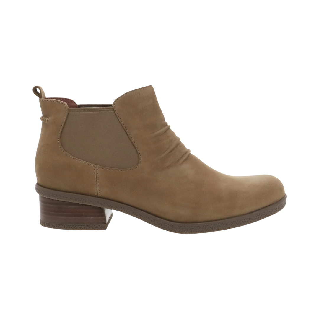 Dansko Women’s Bea Ankle Boot in Biscotti featuring a premium waterproof leather upper, ankle boot silhouette, leather stacked heel, removable molded EVA footbed with memory foam, Dansko Natural Arch® technology, crepe-textured TR rubber outsole, and timeless design built for supportive comfort and everyday versatility.
